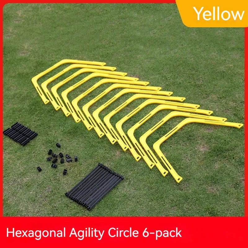 Six foldable yellow, green, and orange hexagon football agility training rings laid out on grass.