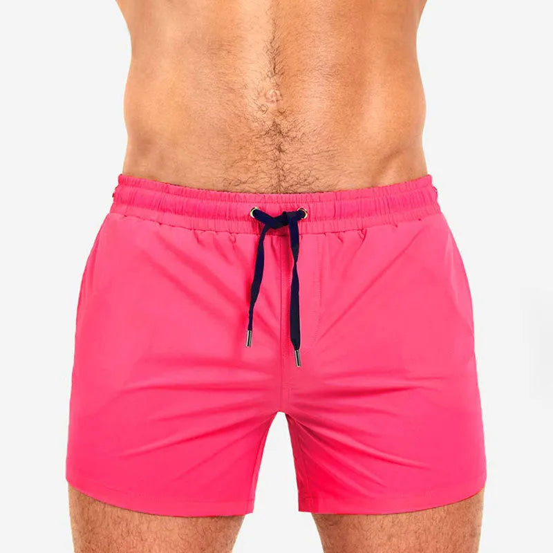 Mesh lining polyester sports shorts in solid colours for swimming and fitness.