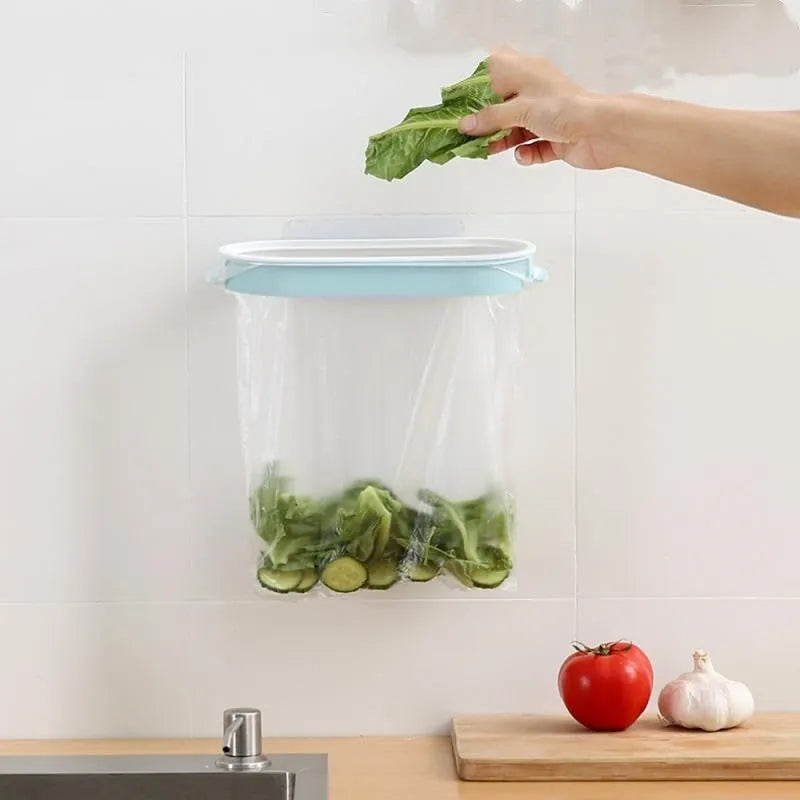 Blue plastic kitchen garbage bag storage rack mounted on wall for bin liner organisation