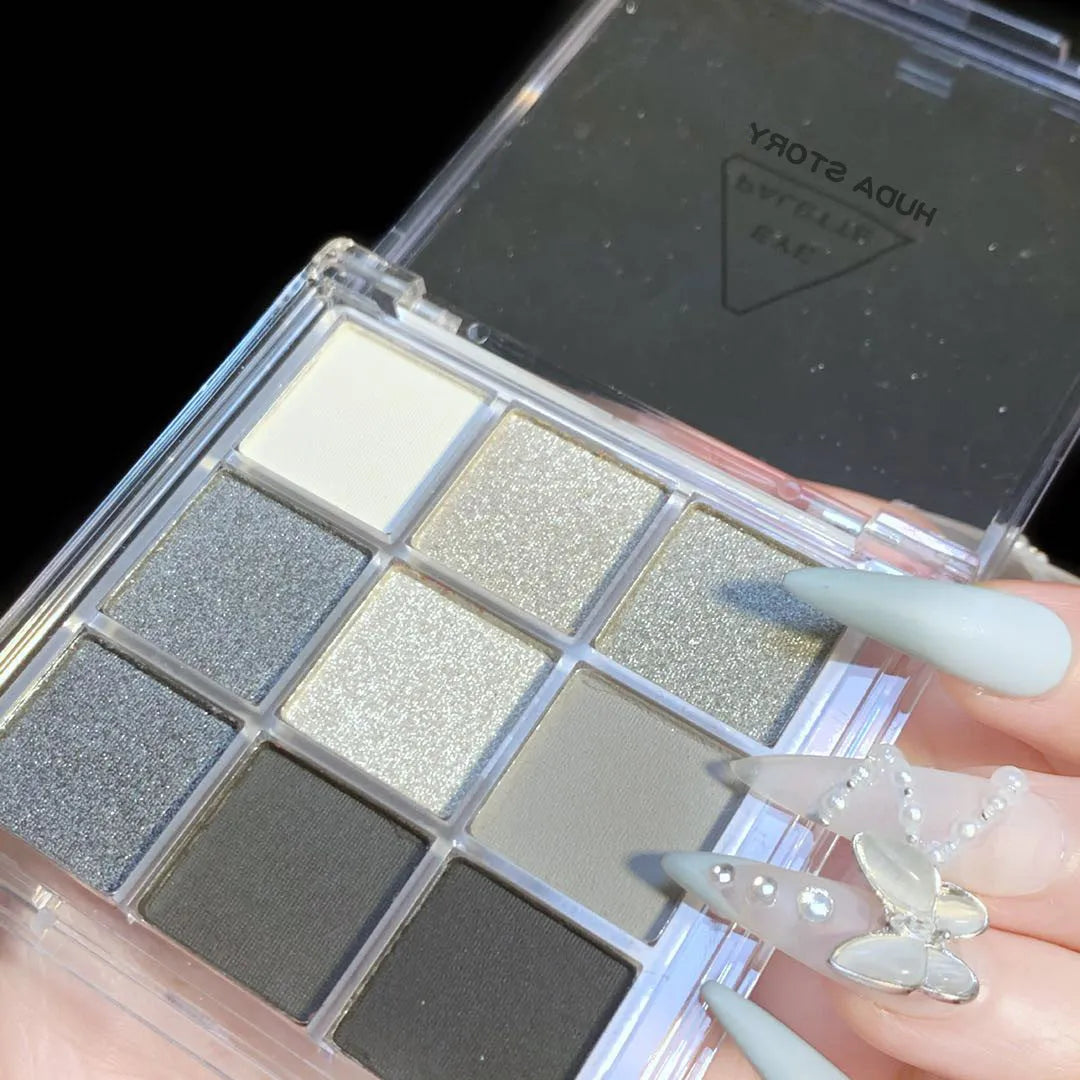 Smoked nine-colour eye shadow compact showing white silver black iron grey cosmetic shades