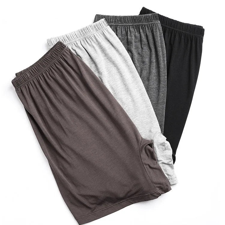 Men's solid colour modal boxer shorts with high waistband, shown in black, blue, gray, and brown.