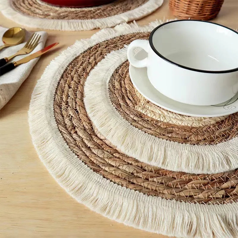 Round papyrus straw placemat with corn rope tassel detailing in modern simplicity style