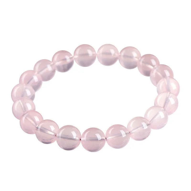 Natural pink starlight crystal round bead bracelet with polished finish in various sizes from 6mm to 22mm