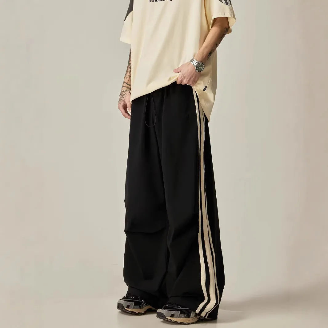 Black men's wide-leg climbing trousers with high waist and straight cut in polyester fabric