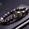 Obsidian fox charm bracelet with adjustable leather cord and sliding knot closure