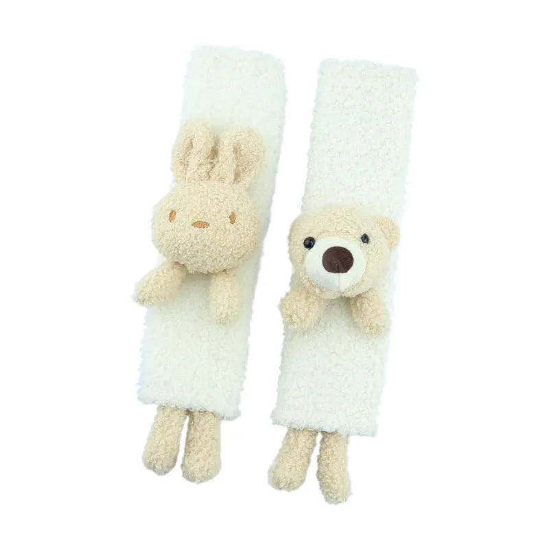 Cartoon plush lamb wool seatbelt shoulder protector in bear and rabbit designs.