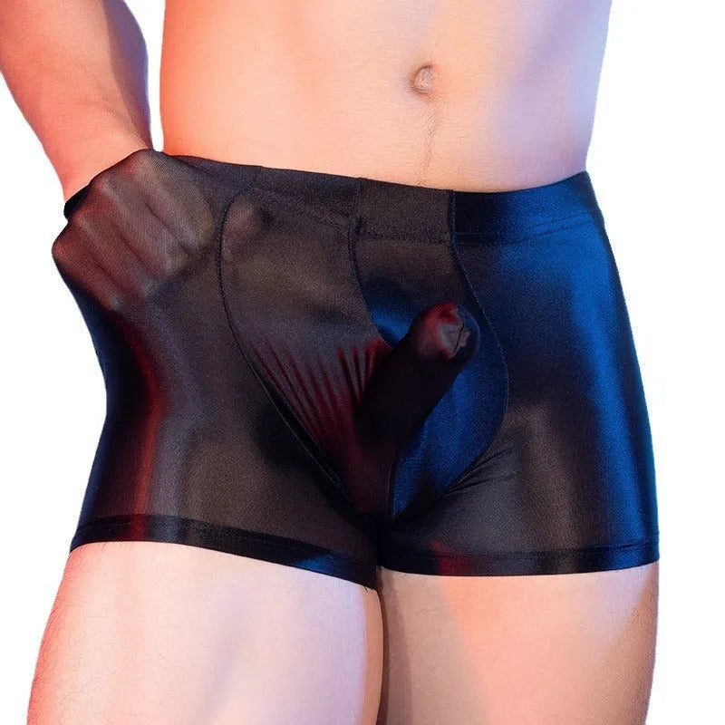 Seamless men's boxers in red nylon fabric with mid waist and elephant nose pouch design.