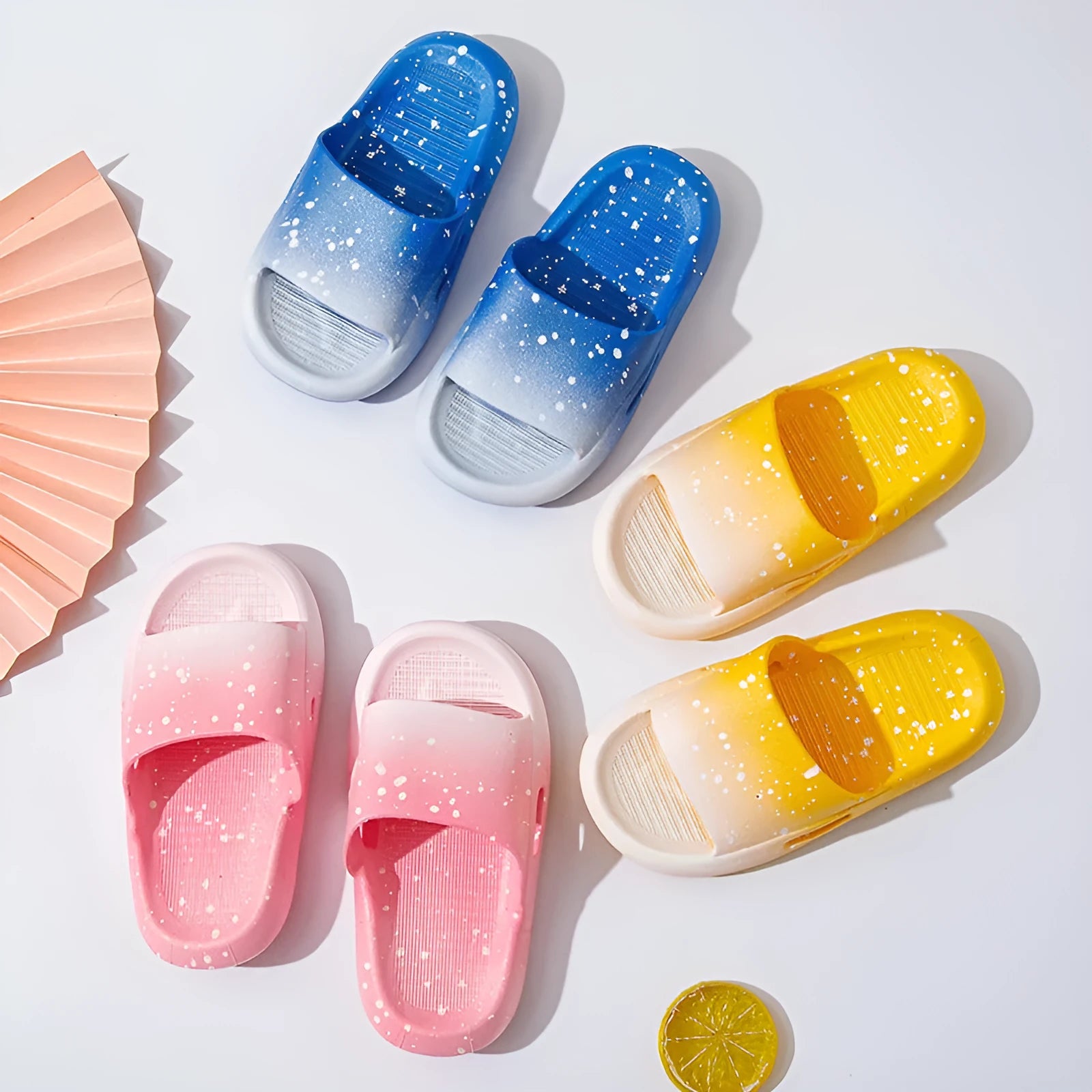 Gradient coloured children's PVC summer slippers with non-slip soles in blue, yellow, green, orange, pink, or black.