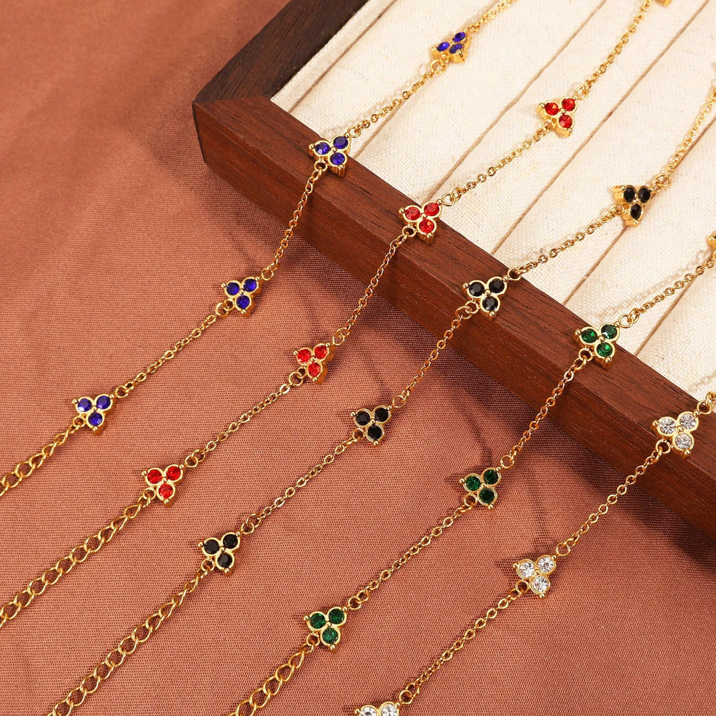 Stainless steel women's bracelet with three triangular diamond motifs set with colourful zircon stones.