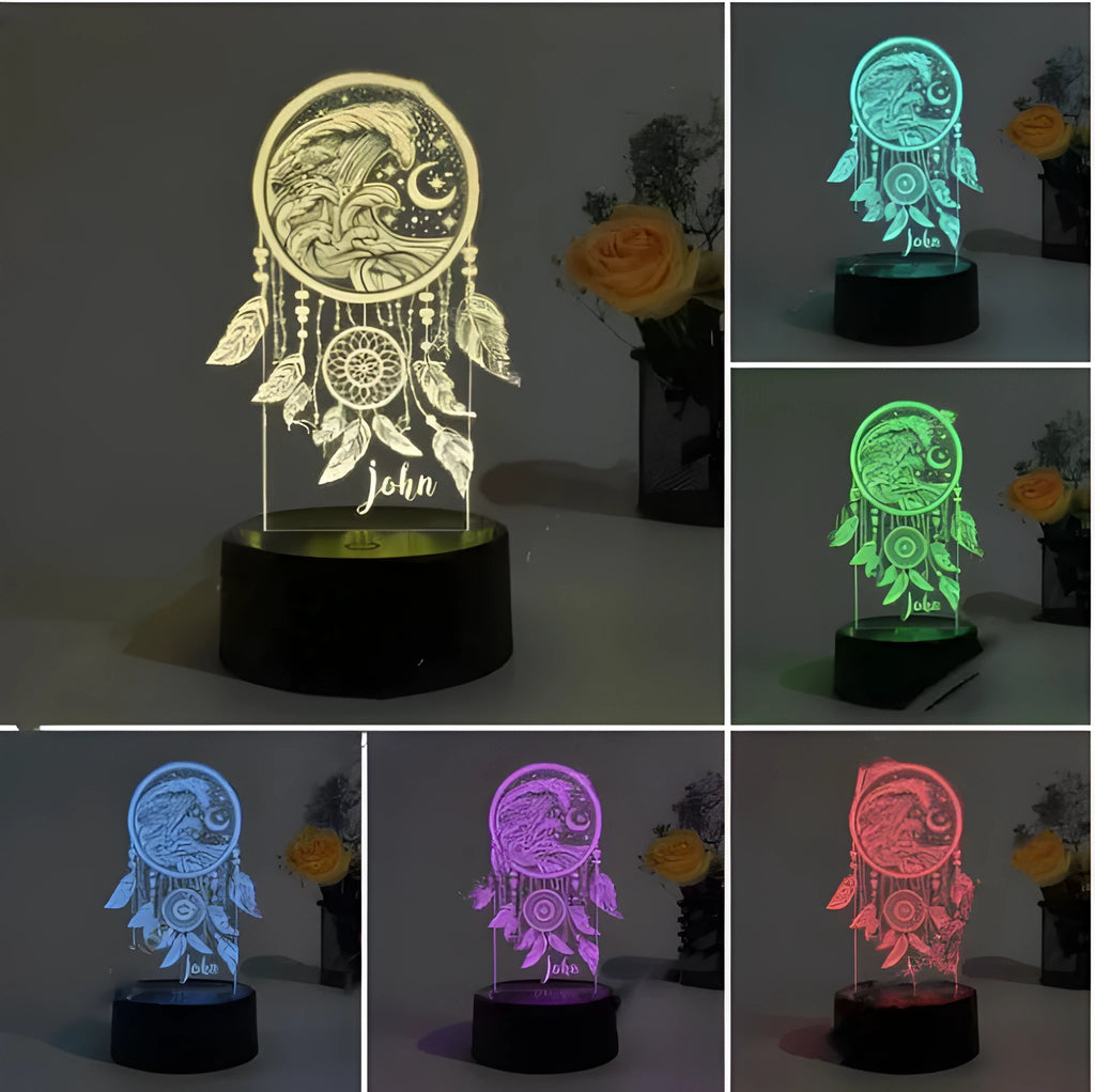 Black-based acrylic dream catcher table lamp with colourful lighting effects on a surface.