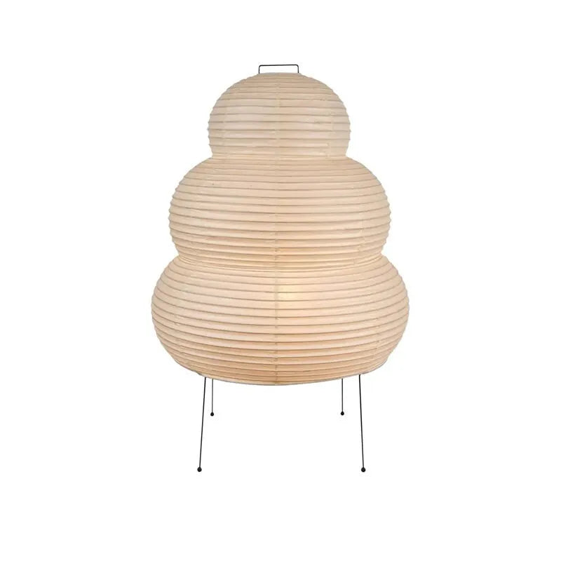 Japanese style rice paper table lamp with aluminium body and decorative shade on wooden surface