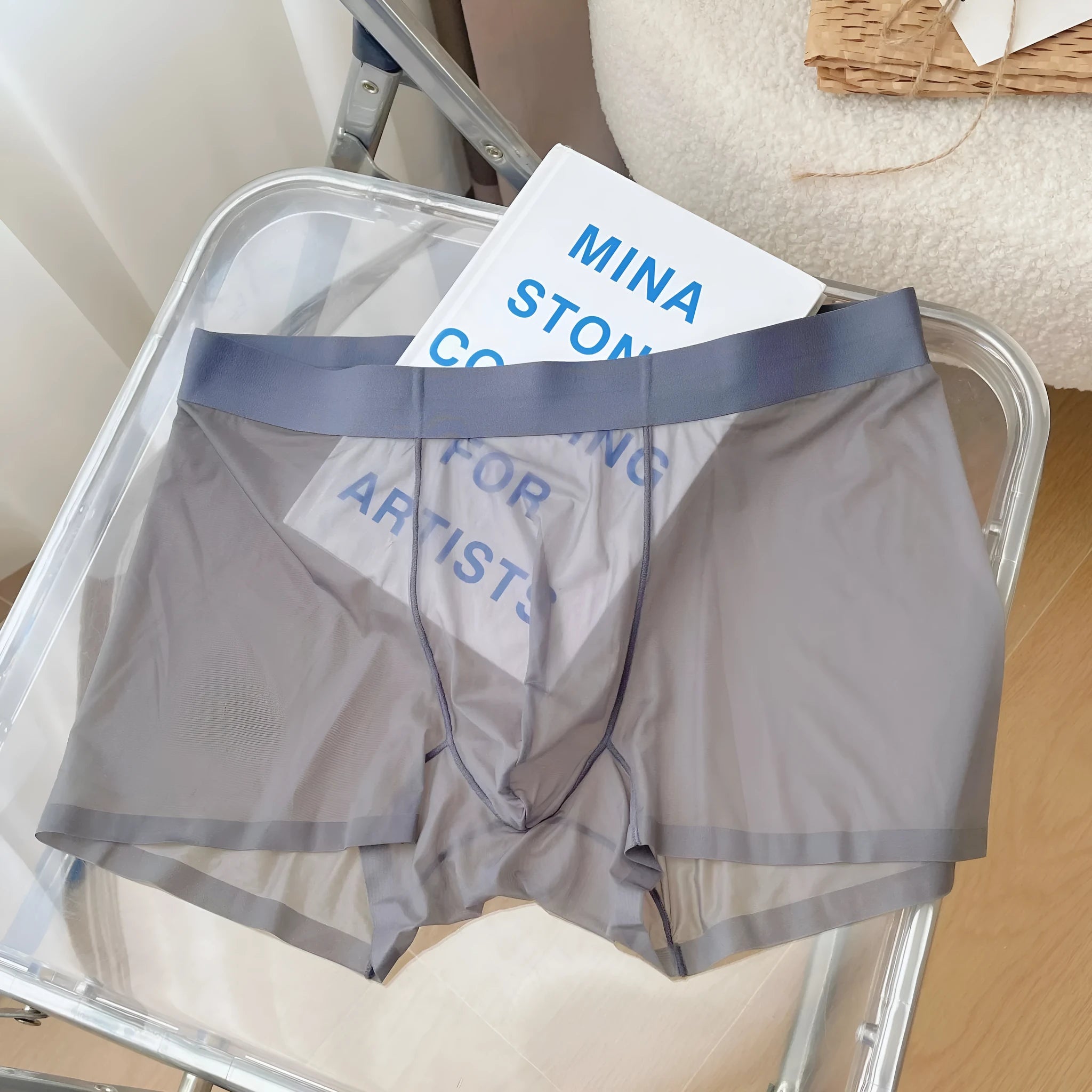 Men's thin knit nylon boxer shorts in rock ash colour showing seamless construction and mid-waist design