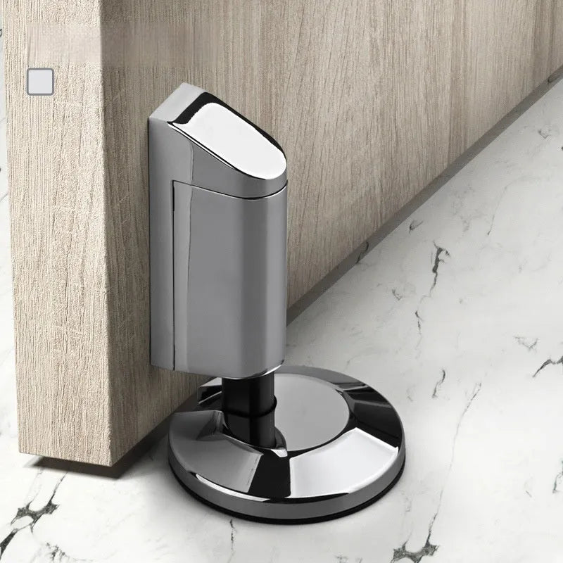 Modern invisible zinc alloy door stopper in six colour finishes on a wall.