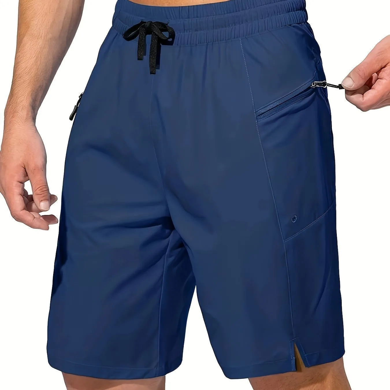 Man wearing solid colour quick-drying polyester beach shorts in a straight leg fit.