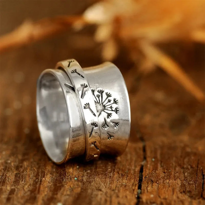 Silver electroplated rotatable flower ring showing floral design and European American sizes 7 to 11