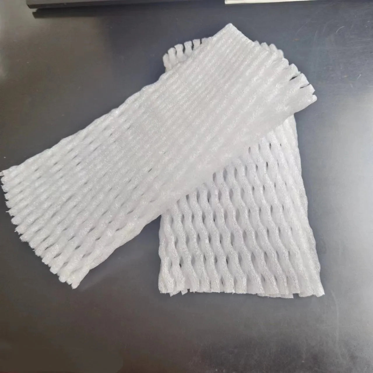 White foam fruit net cover protective case showing shockproof material and multiple size options