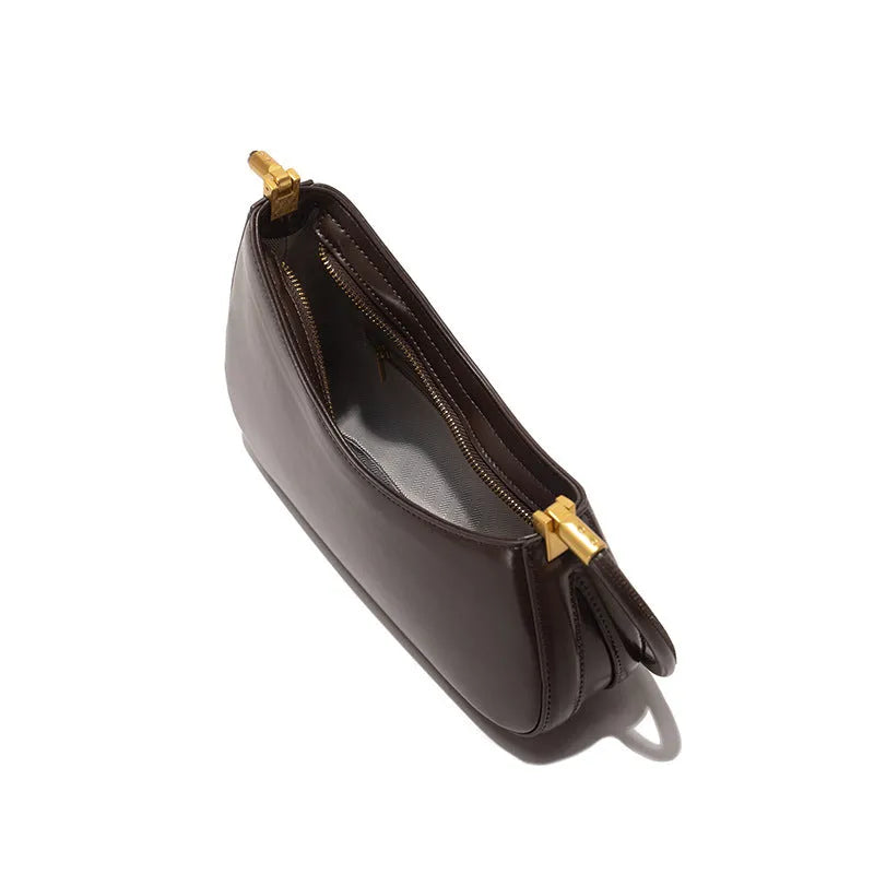 Women's retro oval PU leather shoulder bag in seven colour options with single strap and internal zipper compartment