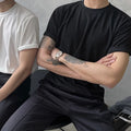 Men's slim fit cotton t-shirt in black with half-length sleeves and round neck