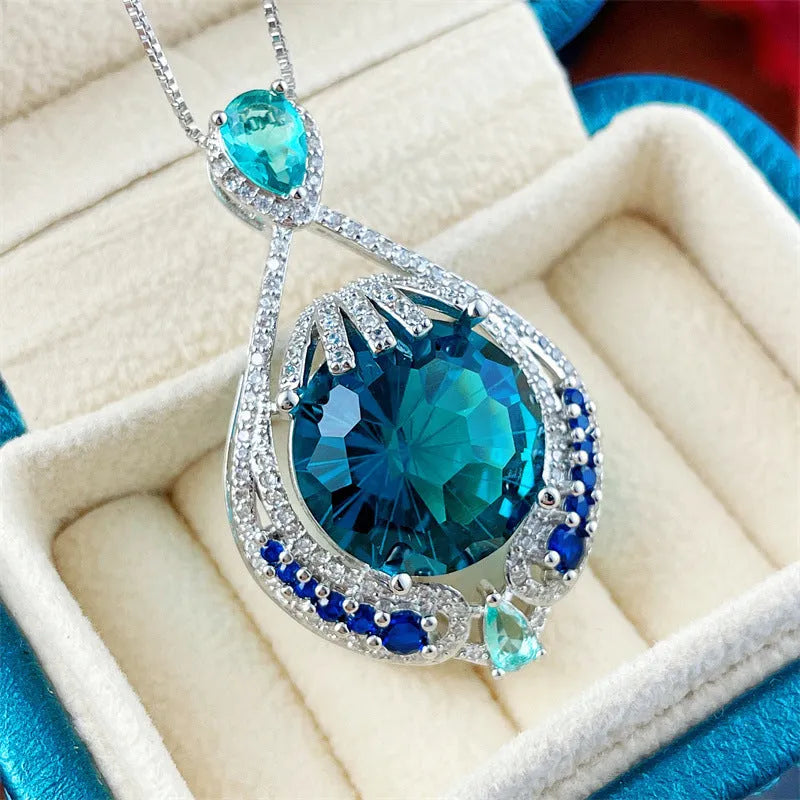 Women's geometric pendant necklace with blue crystal gemstone and water wave chain design