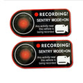 Pair of white electrostatic PVC warning stickers for Tesla car sentry mode, measuring 11 by 5 centimetres.