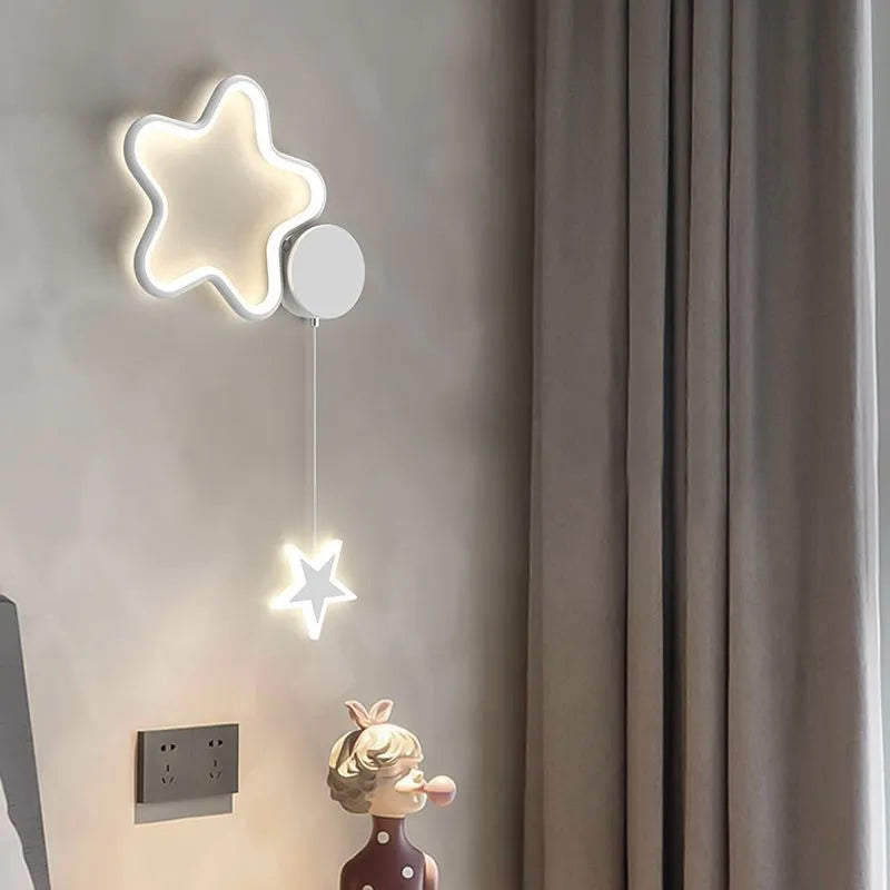 Five-pointed star shaped wall lamp with a cartoon cloud design, available in black or white.
