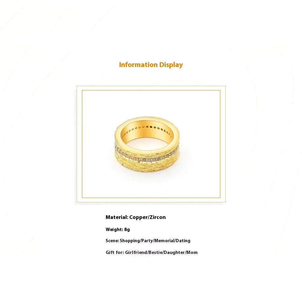 Gold coloured geometric zircon ring for women on a plain background, showing its structured shape.