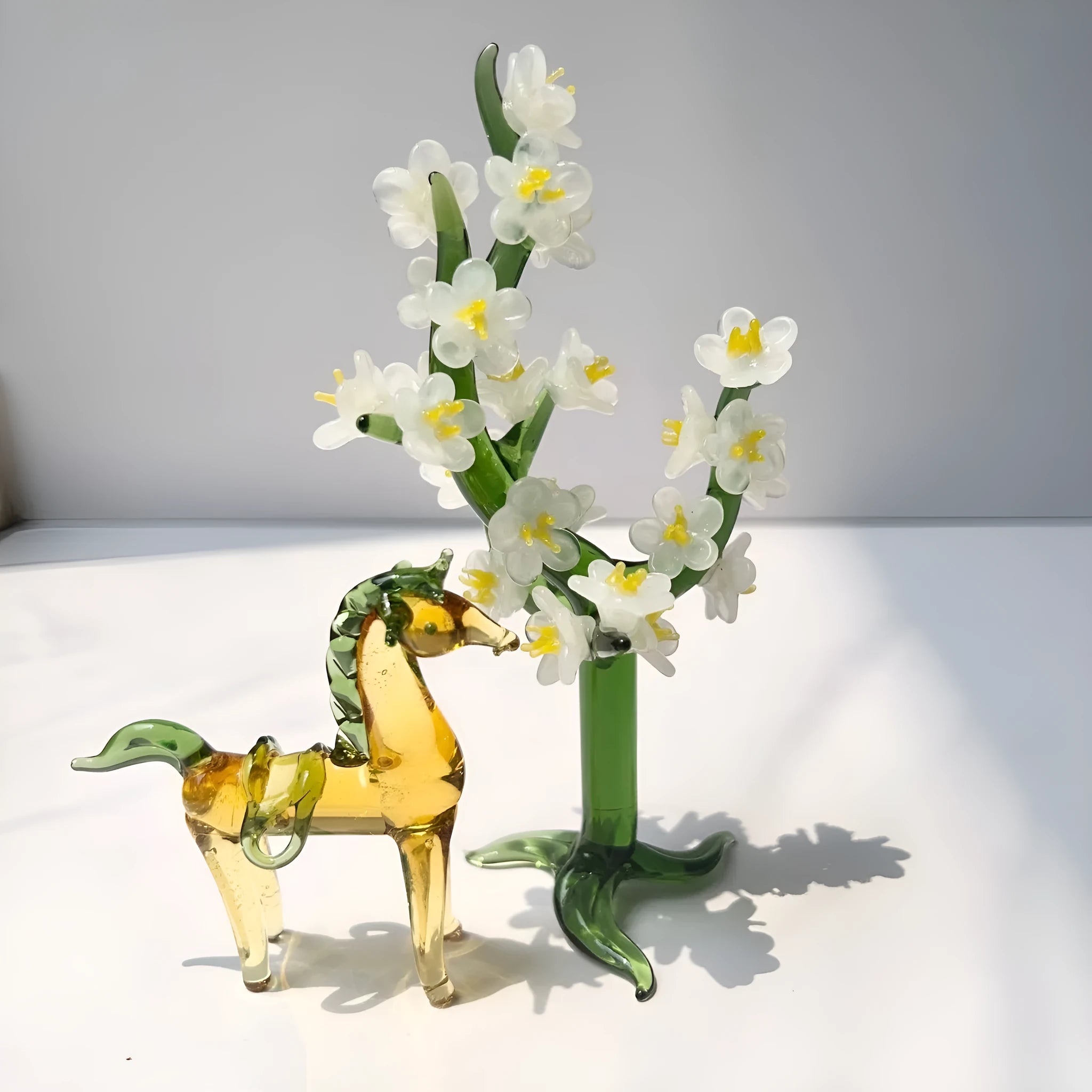 Coloured glaze horse sculpture in brown finish on wooden desk