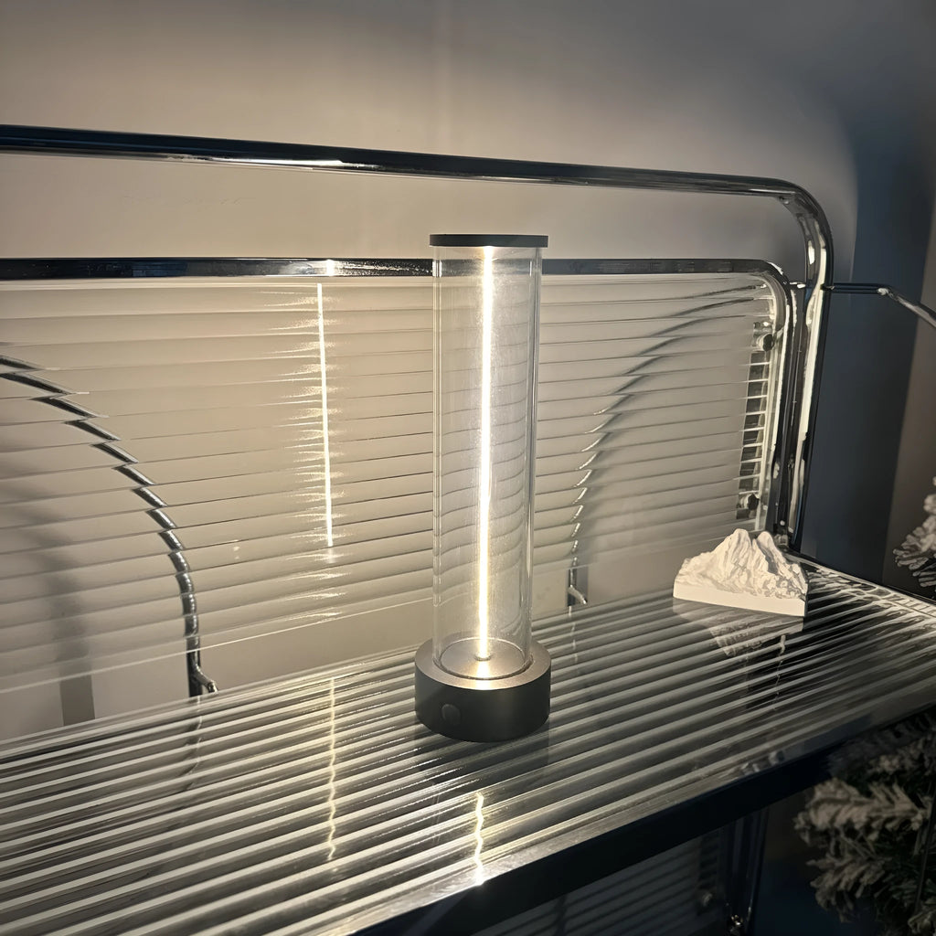 Modern white glass LED line light with magnetic base for USB rechargeable accent lighting