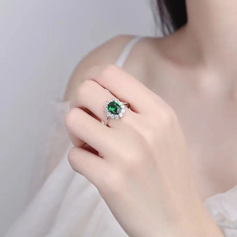 Women's copper floral ring with inlaid zirconium detail in green, blue, or red.