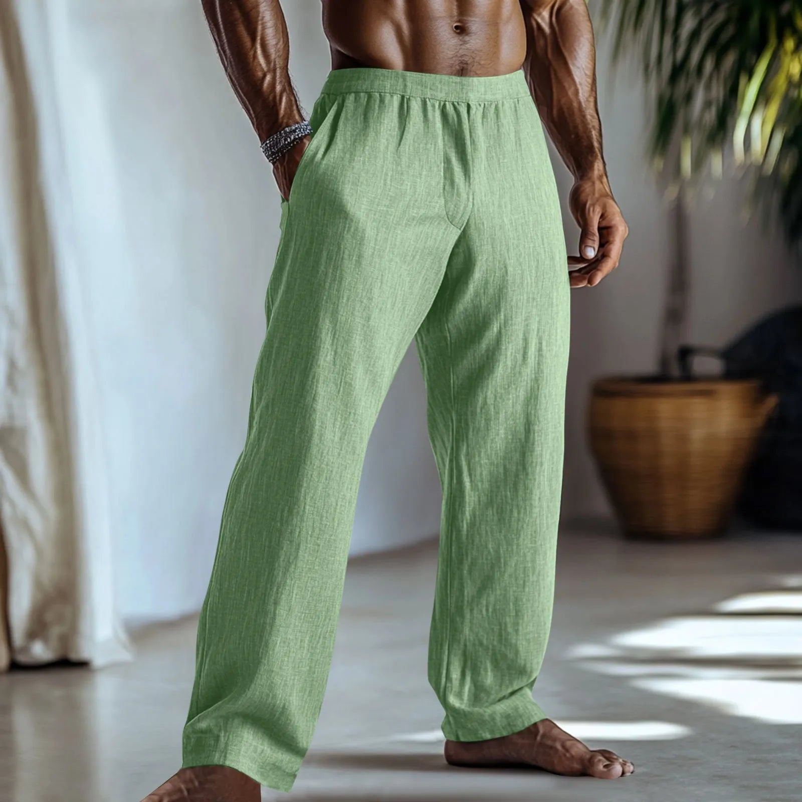 Straight-leg cotton and linen casual trousers in light green colour with visible pockets.
