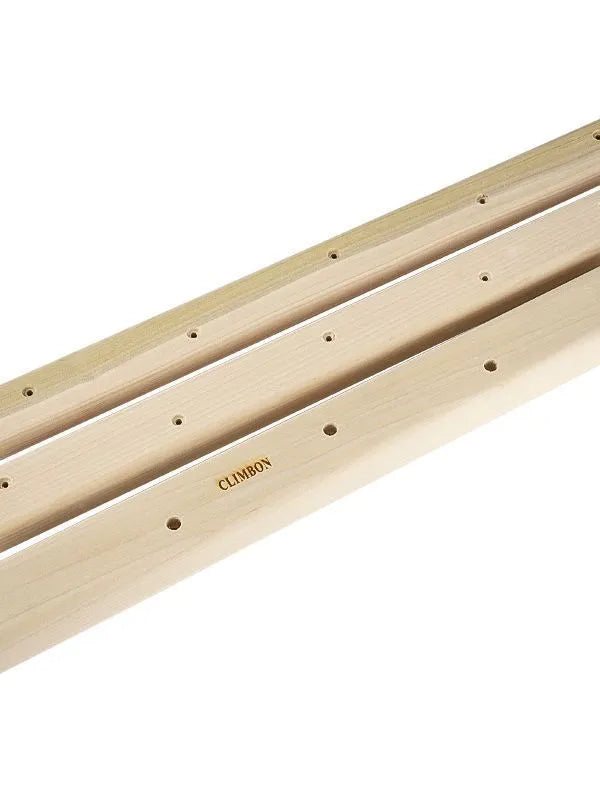 Set of three solid wood grip strength training hangboards in varying thicknesses.
