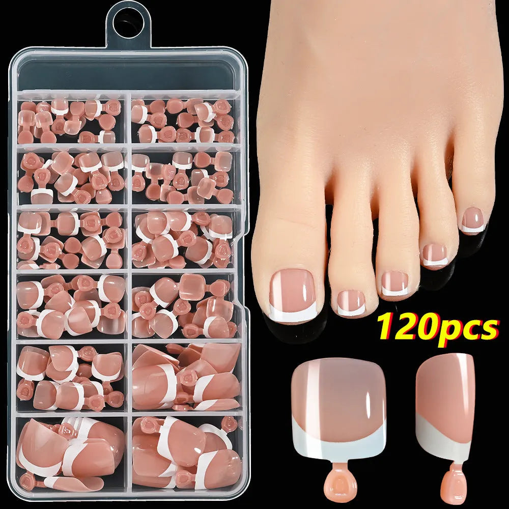 Box of 120 French white edge press-on toe nails in full square short shape showing multiple nude shades.