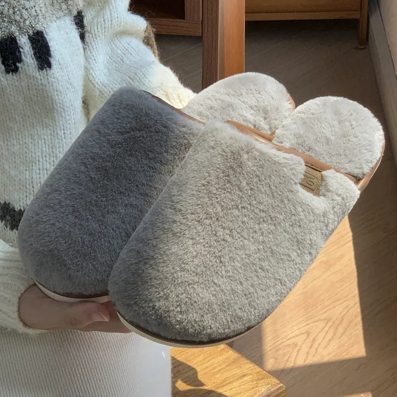 Solid colour PVC winter plush house slippers with car stitching detail on a non-slip sole.