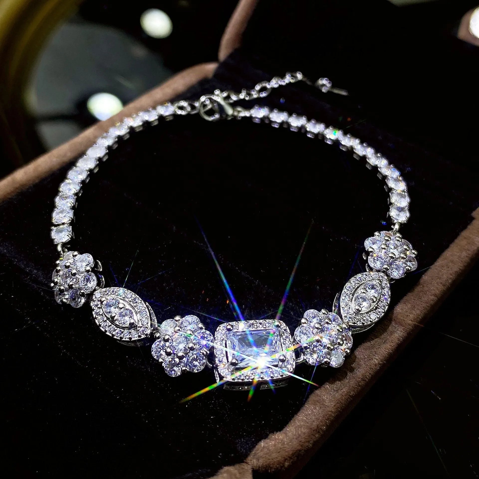 Women's geometric bracelet with silver and white gold plating and sparkling inlaid zircon stones.