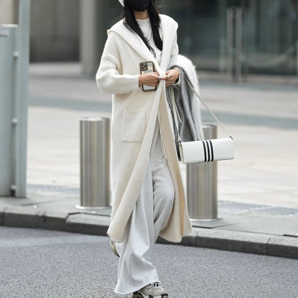 Long grey knitted cardigan with hooded trench coat design and regular long sleeves
