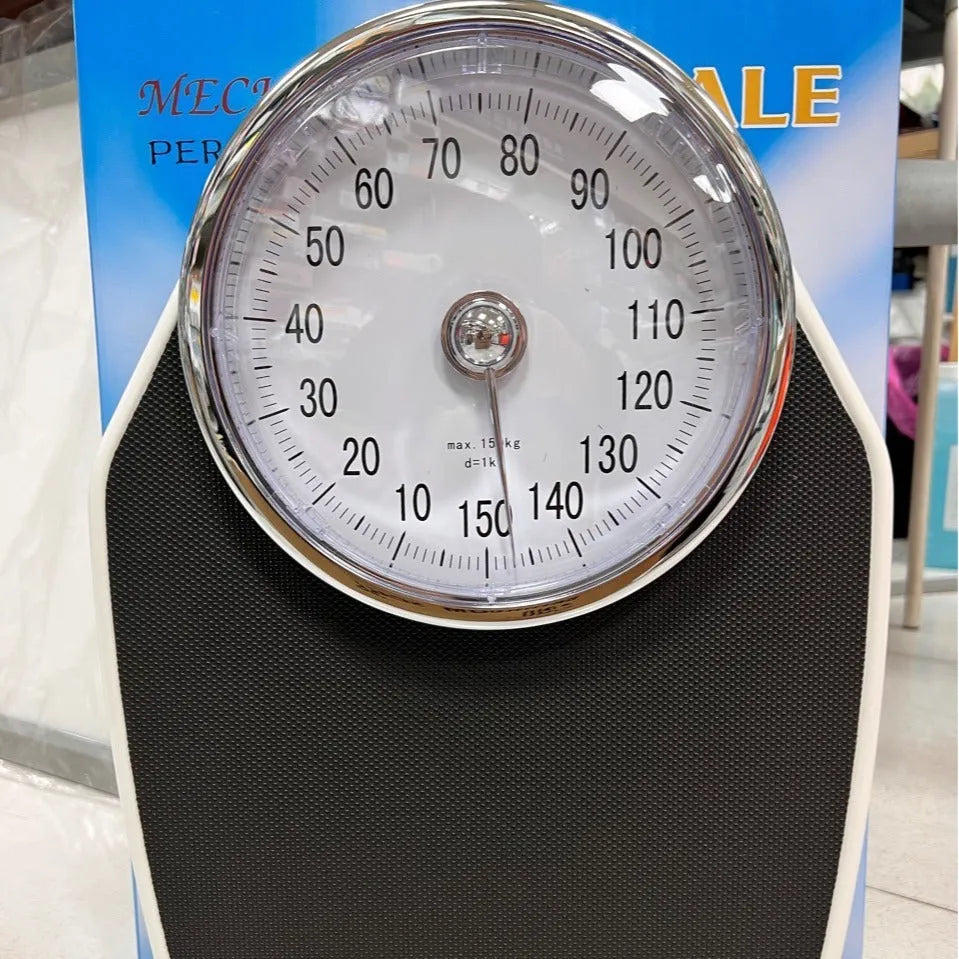 Black mechanical pointer body weight scale with large dial showing 180kg capacity