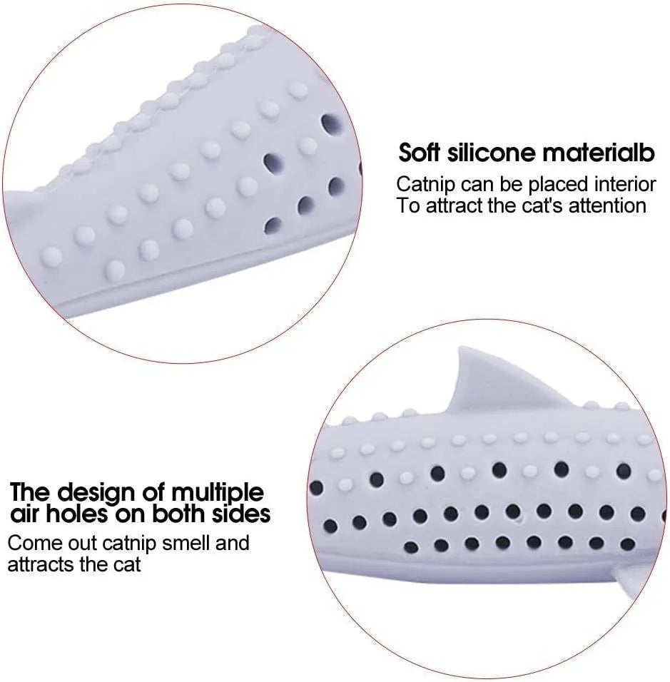 Green silicone fish shaped cat chew toy with breathable side holes on a white background