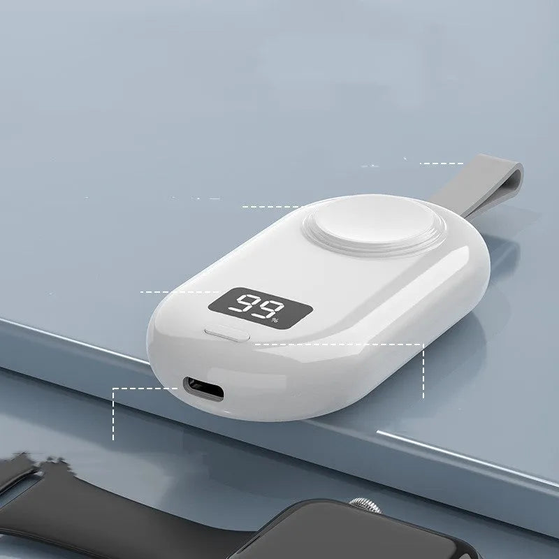 White V5 watch wireless power bank with Type-C port next to included USB cable
