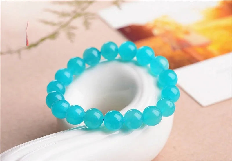 Amazonite natural scattered beads in ice colour showing polished surface and hole drilling