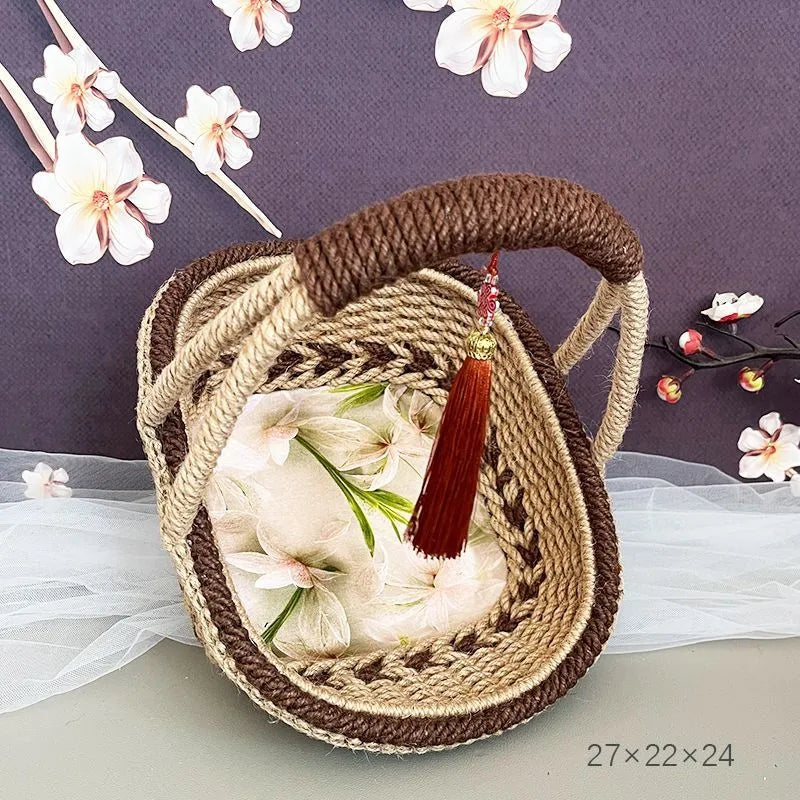 Hand-woven hemp rope basket in rustic coffee brown colour, measuring 19cm by 12cm.