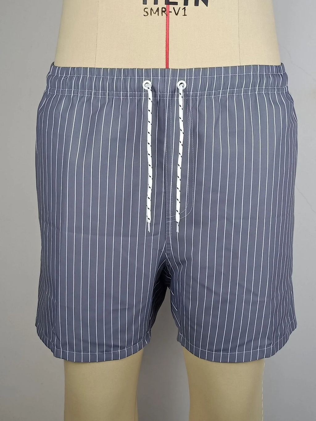 Polyester striped beach shorts with straight leg opening in navy blue, grey, khaki, or light blue colour options