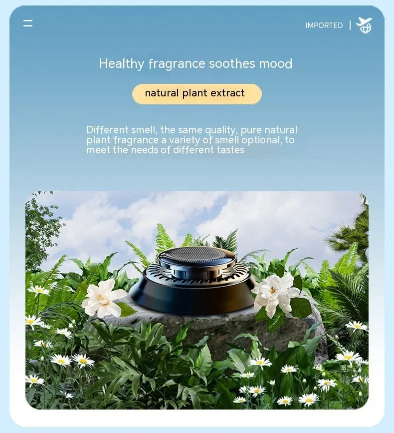 Solar powered kinetic car air freshener with rotating double rings on vehicle dashboard