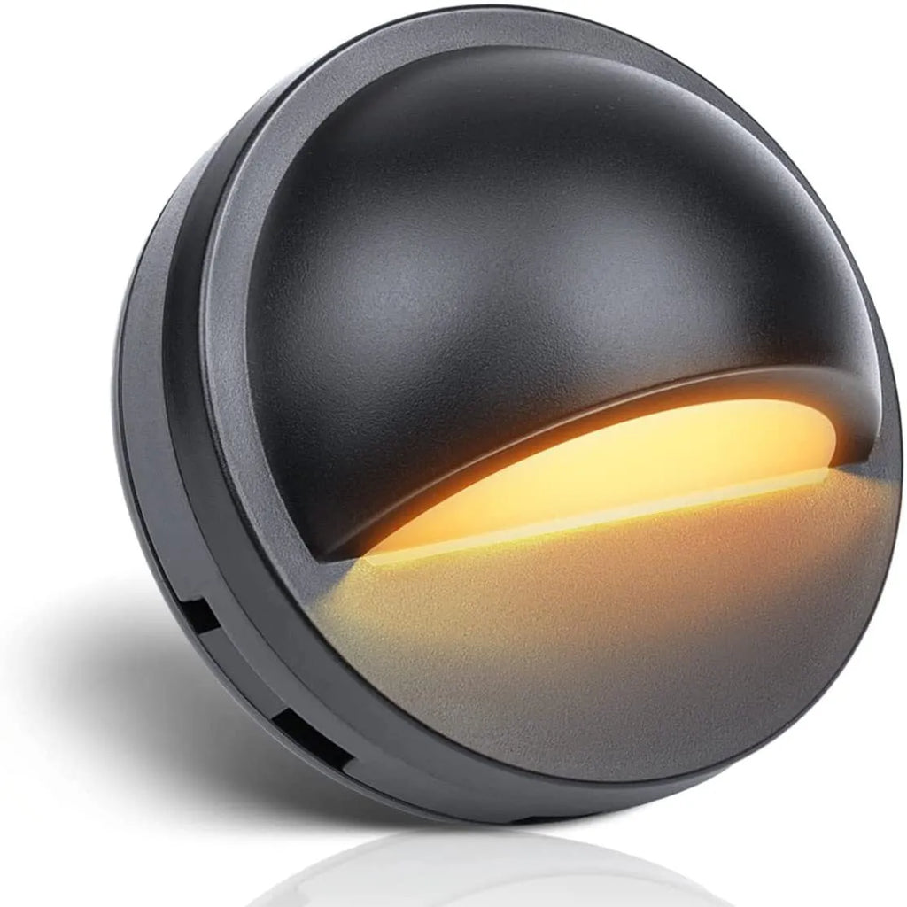 Platinum-coloured low-voltage outdoor step light for garden paths with IP67 rating.