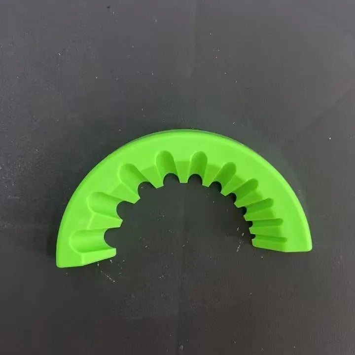 Yellow, green, and black plastic angle grinder bracket holder for sealant cartridges.