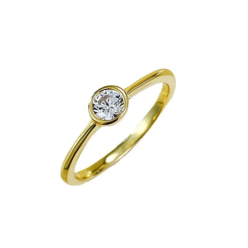 Minimalist crown-shaped silver ring with linear details, shown in gold and platinum electroplated finishes.