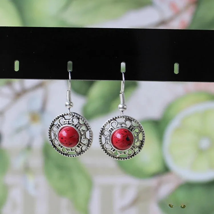 Geometric turquoise flower disk earrings in Miao silver with ethnic patterns