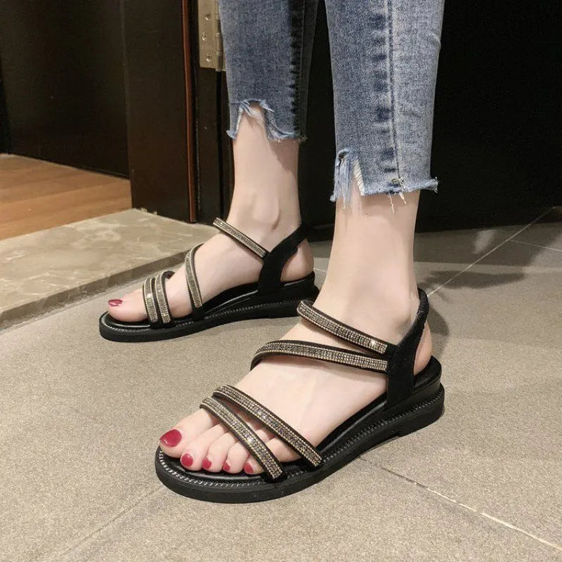 Korean style women's flat sandals with rhinestone decoration on a PU upper and rubber sole, shown in gold colour.