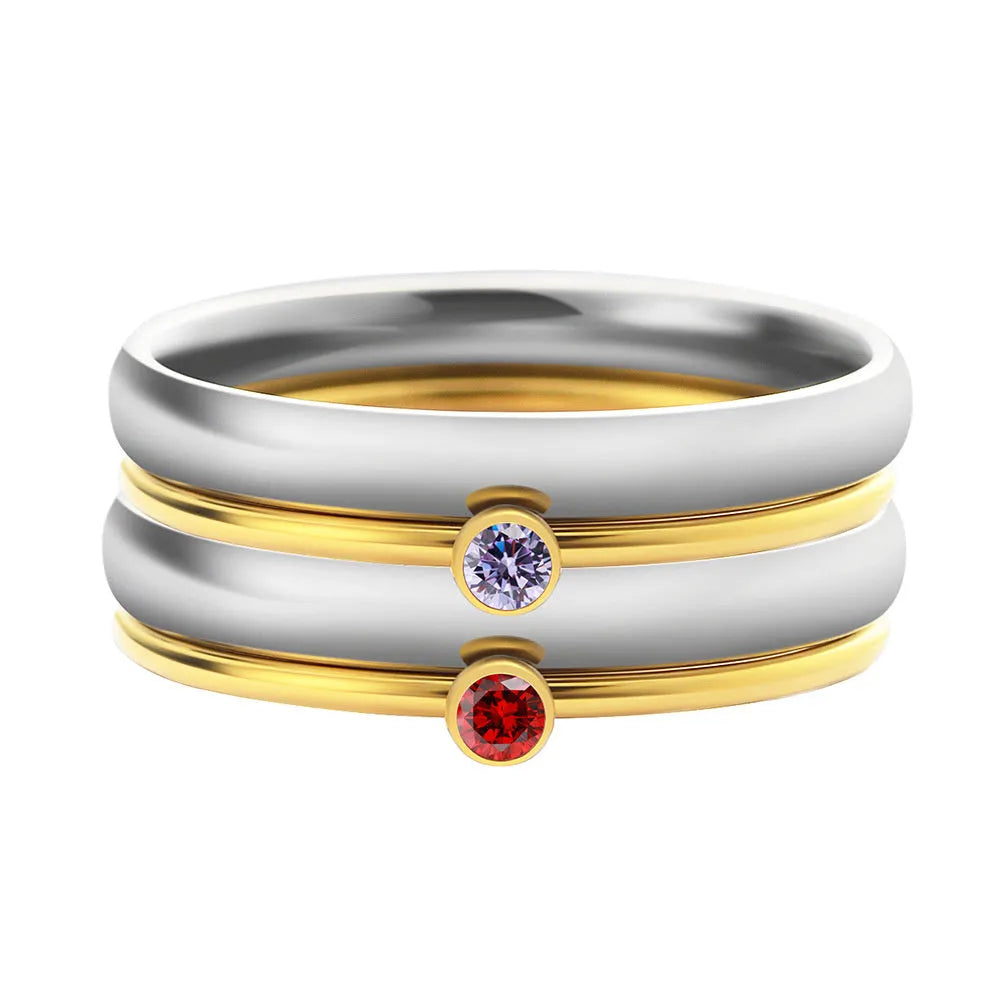 December colour birthstone engraved titanium steel ring with geometric design on a white background.