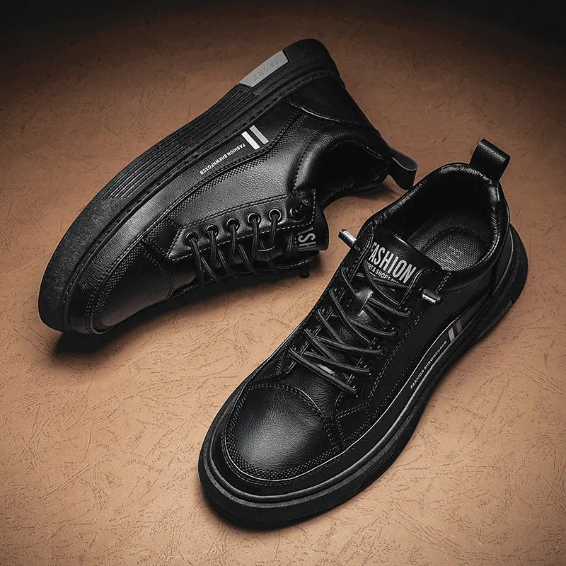 Men's white and black low-top skate shoes with an elastic band and round toe on a rubber sole.