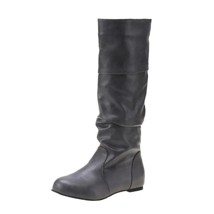 Women's black slip-on flat ankle boots with round toe and rubber sole.